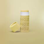 Load image into Gallery viewer, Front view of Nöz Color Variety Sunscreen. Yellow with cap off
