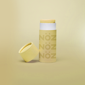 Front view of Nöz Color Variety Sunscreen. Yellow with cap off